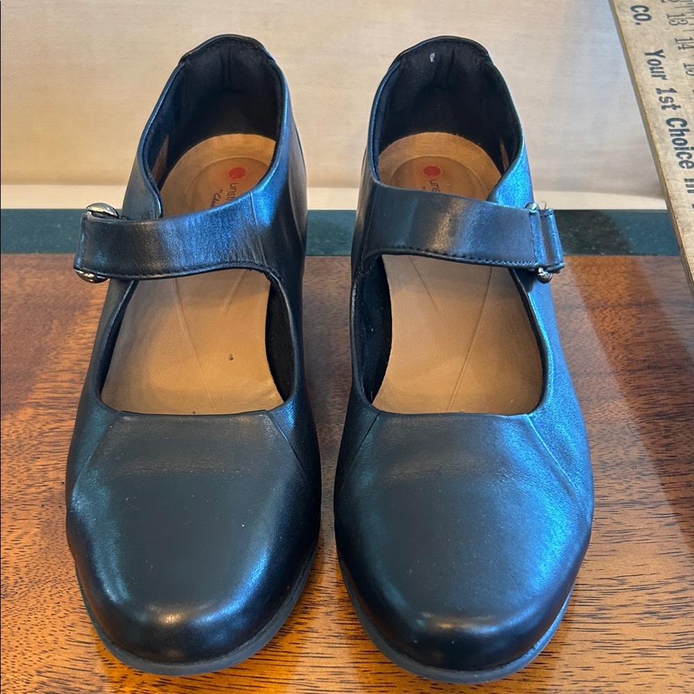 Instructed by Clark’s heeled Mary Jane’s with Velcro strap 9M